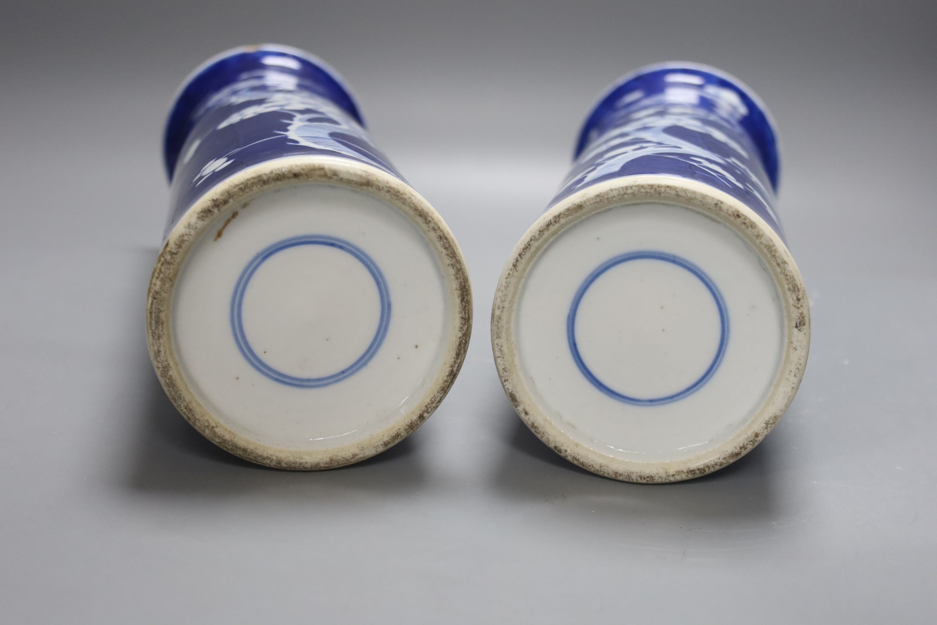 An 18th century Chinese famille rose mug, a Chinese Imari tea caddy and two Chinese blue and white sleeve vases 30cm (4)
